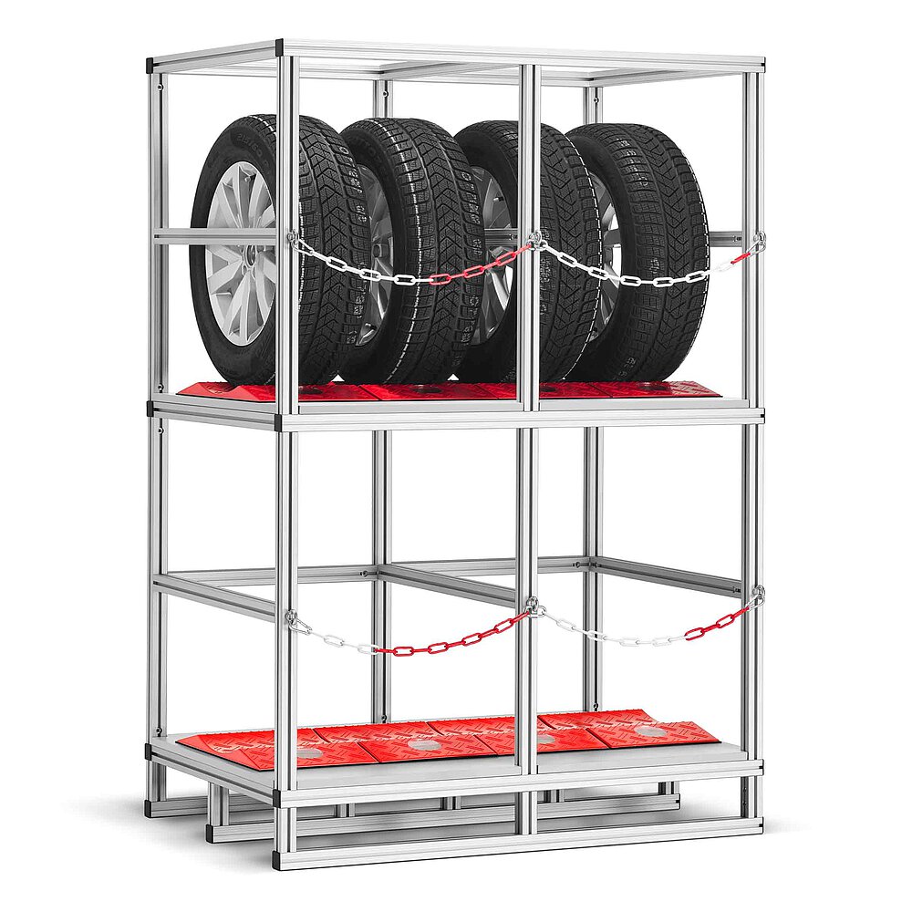 a tyre rack made of aluminium profiles with two storeys, each lined with red TyreGuard® tyre protectors and the upper storey loaded with four tyres on alloy rims, both storeys secured with a cross-wise chain, isolated on white background