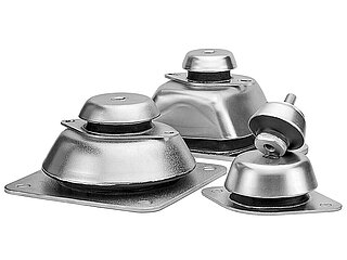 a group picture of six different silver-coloured bolt-on vibration dampers made of metal, with drilled base plates for floor-fastening, bell-shaped metal caps and in-between-galvanized black rubber, isolated on white background